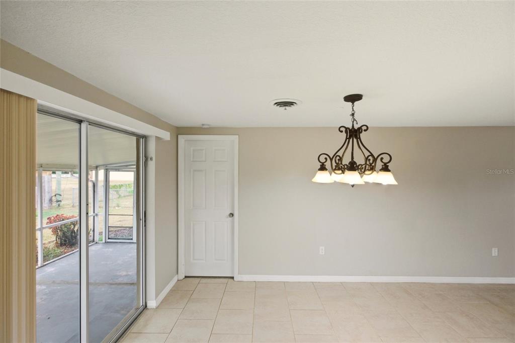 1107 Seneca Road Venice, FL 34293 - Photo 8 of 30 a view of a livingroom with a chandelier