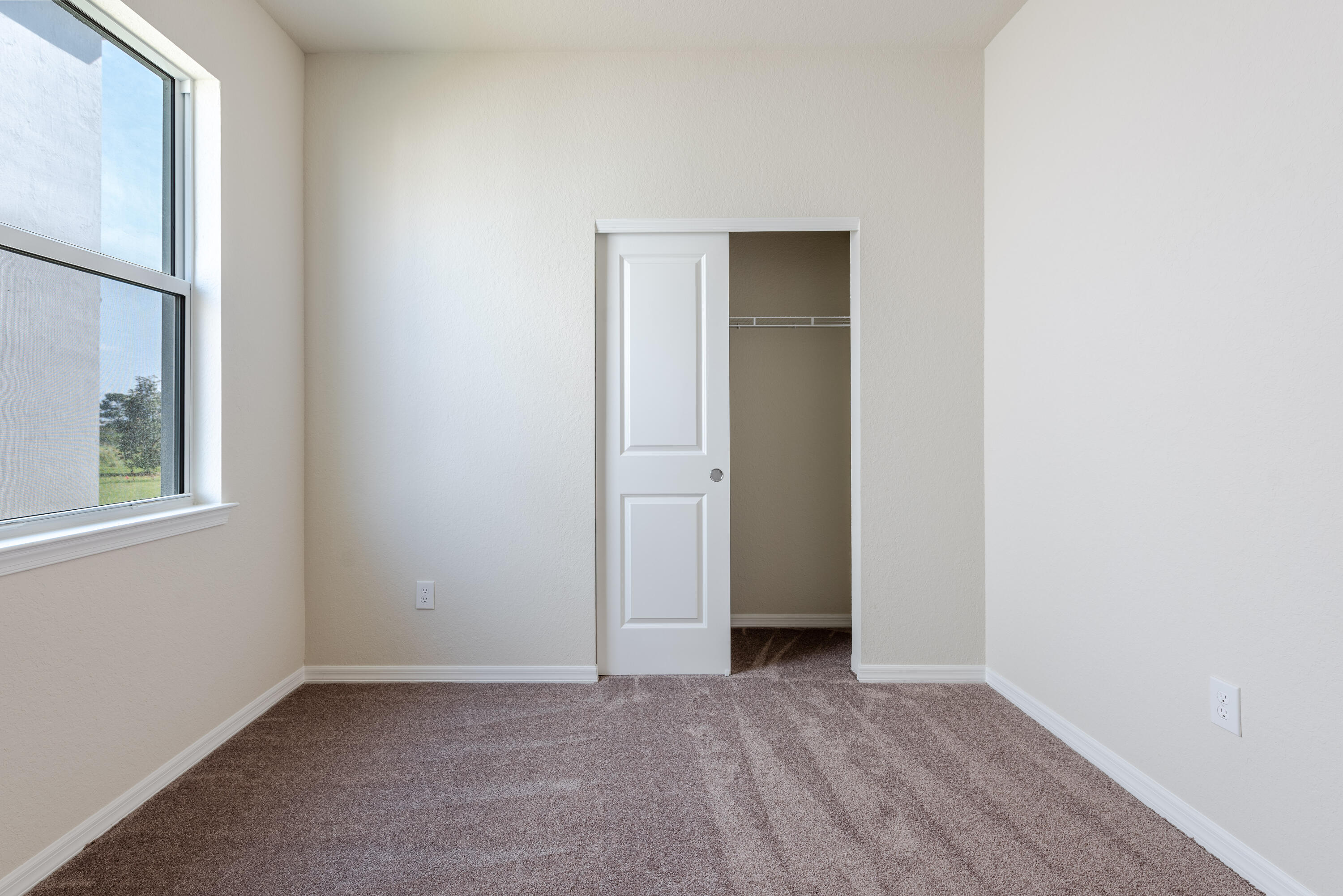 12327 Southwest Sand Dollar Way Port St. Lucie, FL 34987 - Photo 15 of 29 a view of an empty room with closet and a window