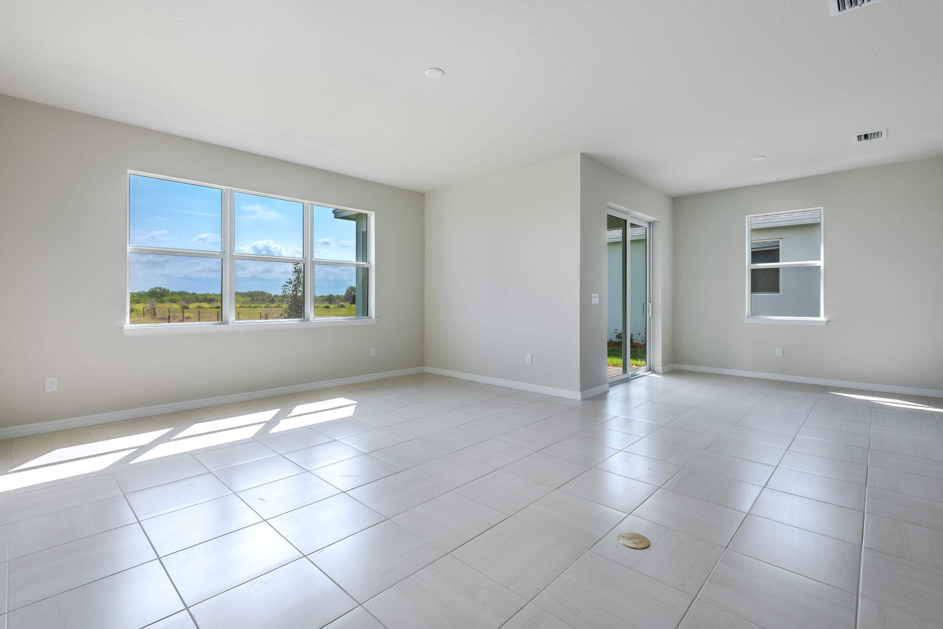 12327 Southwest Sand Dollar Way Port St. Lucie, FL 34987 - Photo 21 of 29 a view of an empty room with a window
