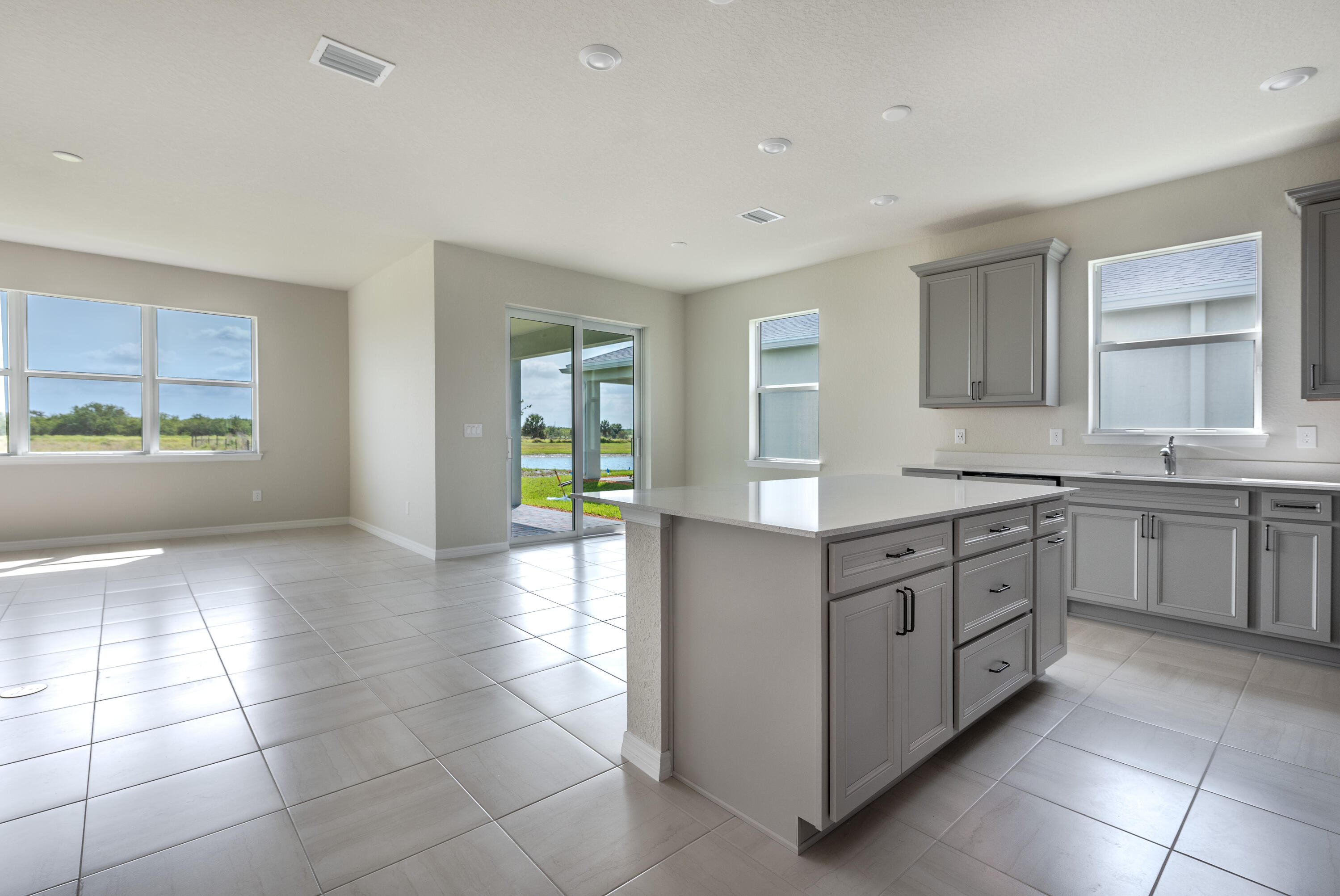 12327 Southwest Sand Dollar Way Port St. Lucie, FL 34987 - Photo 27 of 29 a kitchen with a cabinets and counter space