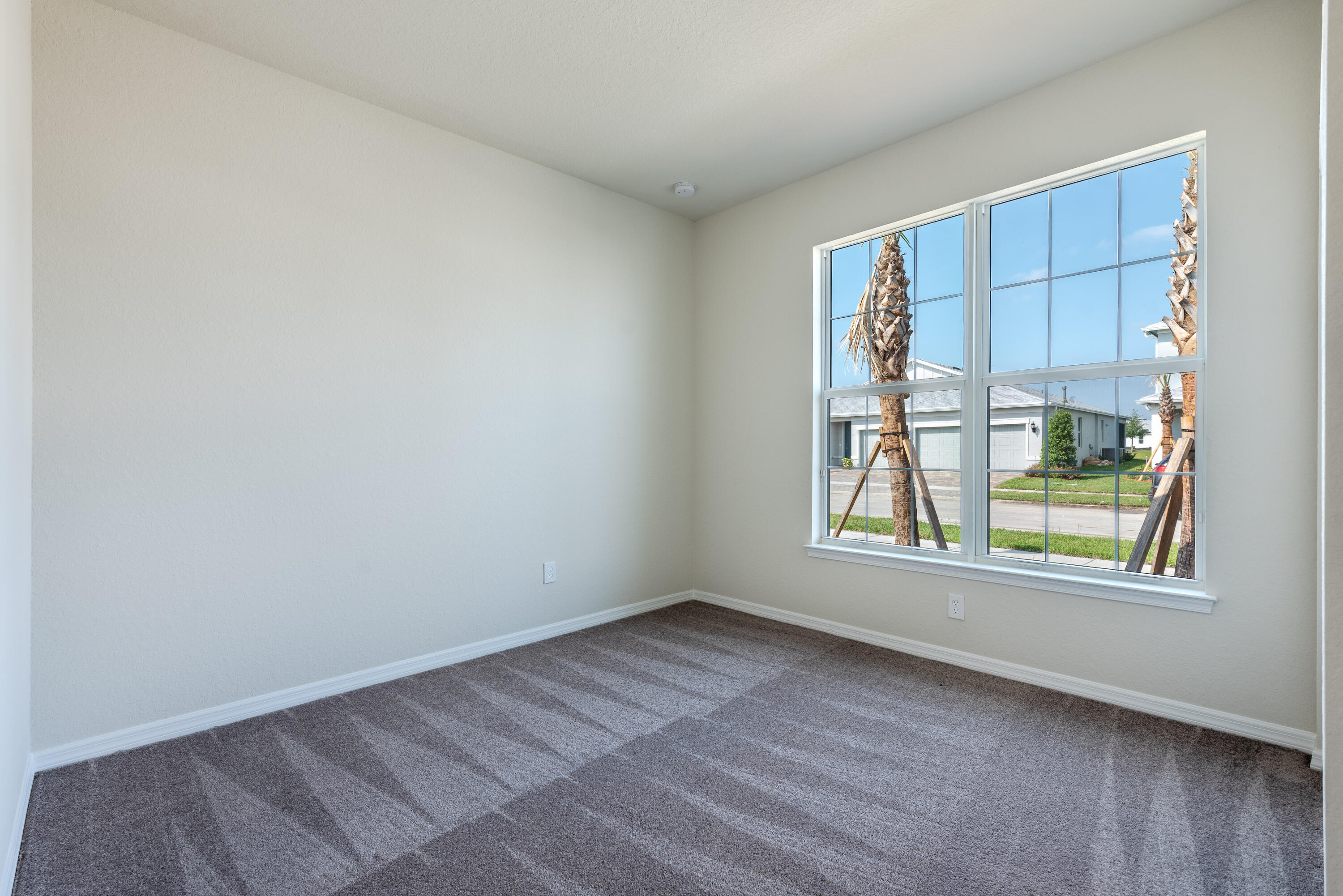 12327 Southwest Sand Dollar Way Port St. Lucie, FL 34987 - Photo 4 of 29 an empty room with windows and closet