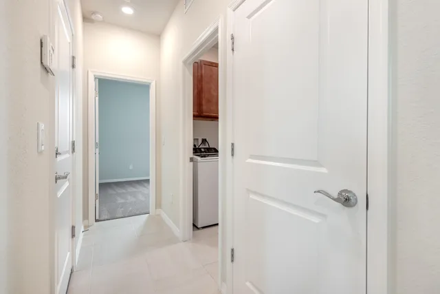 a view of storage and utility room with washer and dryer