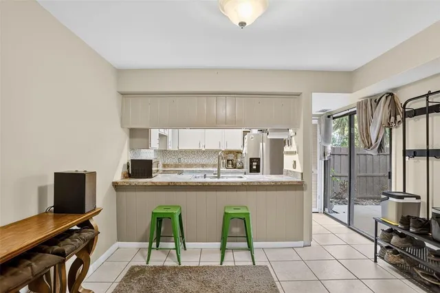 a view of an empty room with stairs and ventilation