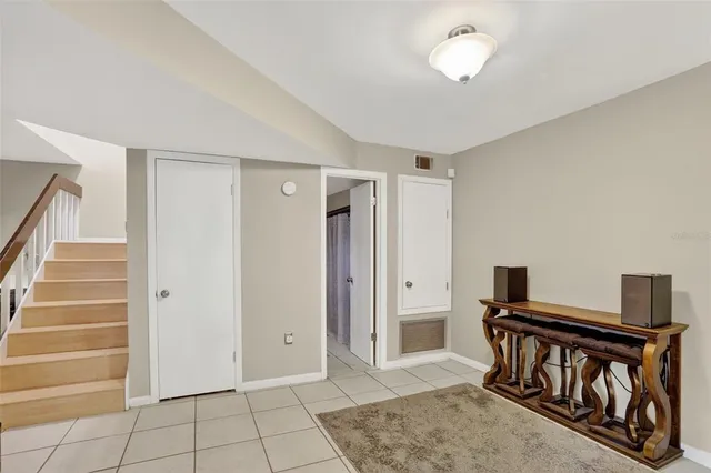 a kitchen with stainless steel appliances granite countertop a sink stove a refrigerator and cabinets