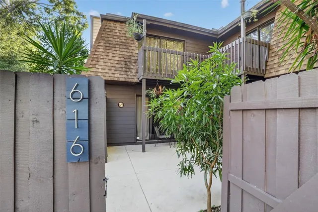 a potted plant sitting in front of a door