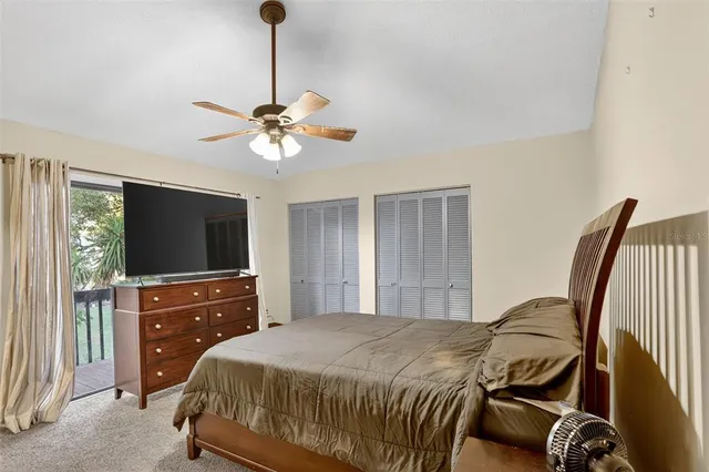 a bathroom with a granite countertop sink toilet and mirror