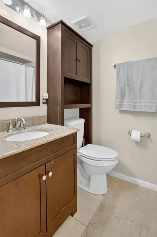 a view of a livingroom with a chandelier fan