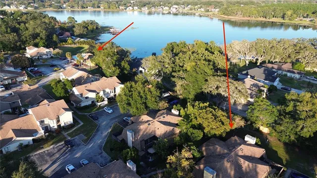 an aerial view of a house with a yard and garden