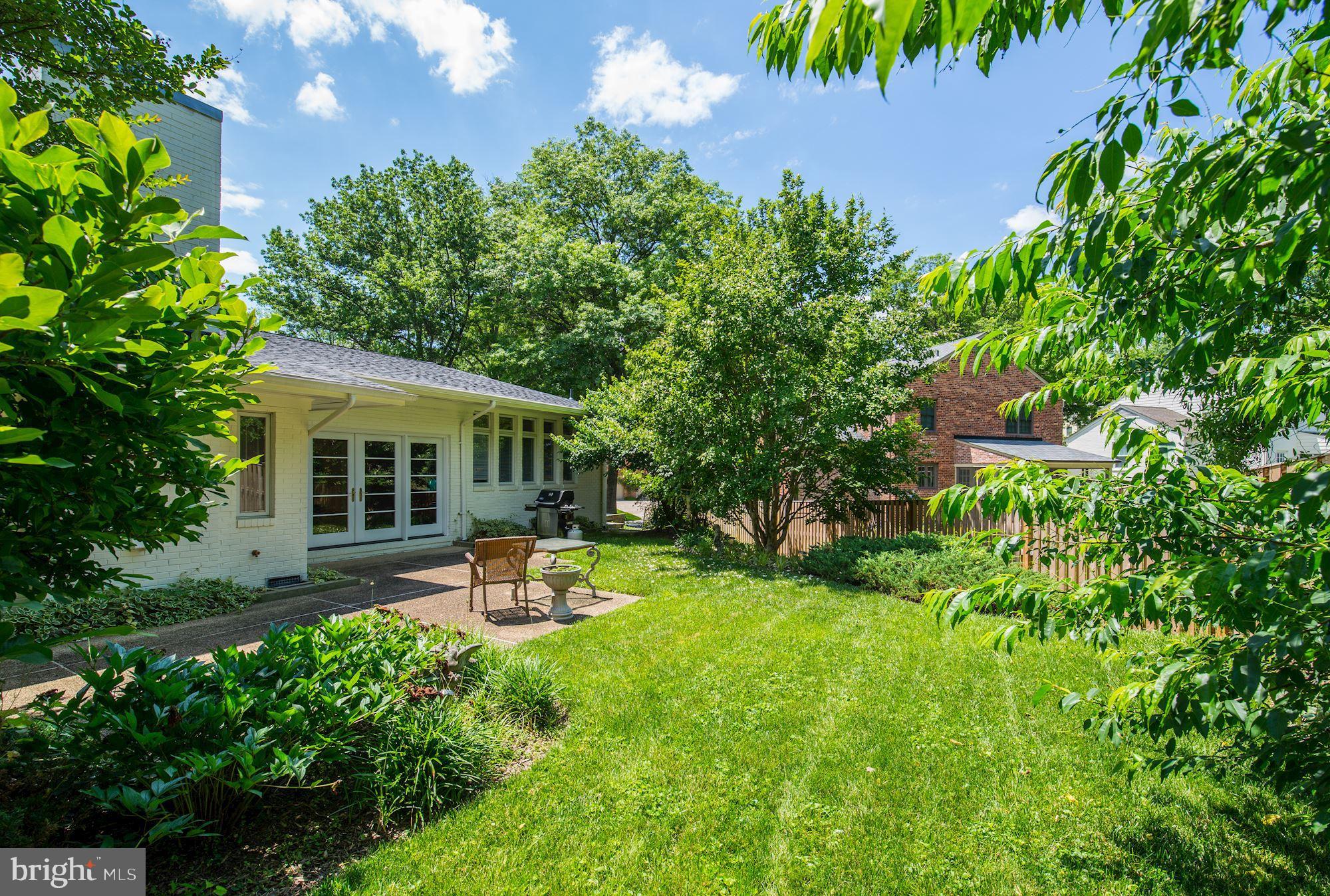 6129 Overlea Road Bethesda, MD 20816 - Photo 1 of 30 an outdoor space with furniture and garden