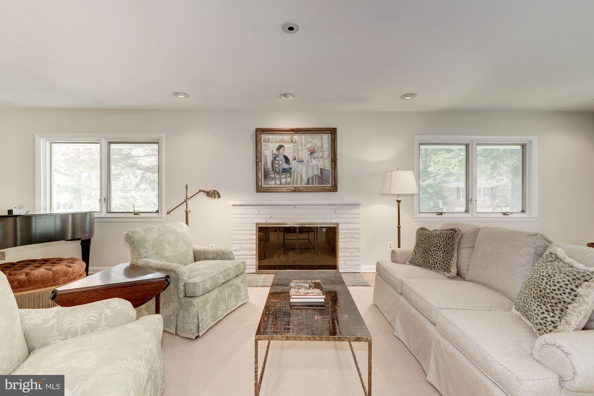6129 Overlea Road Bethesda, MD 20816 - Photo 13 of 30 a living room with furniture and a fireplace