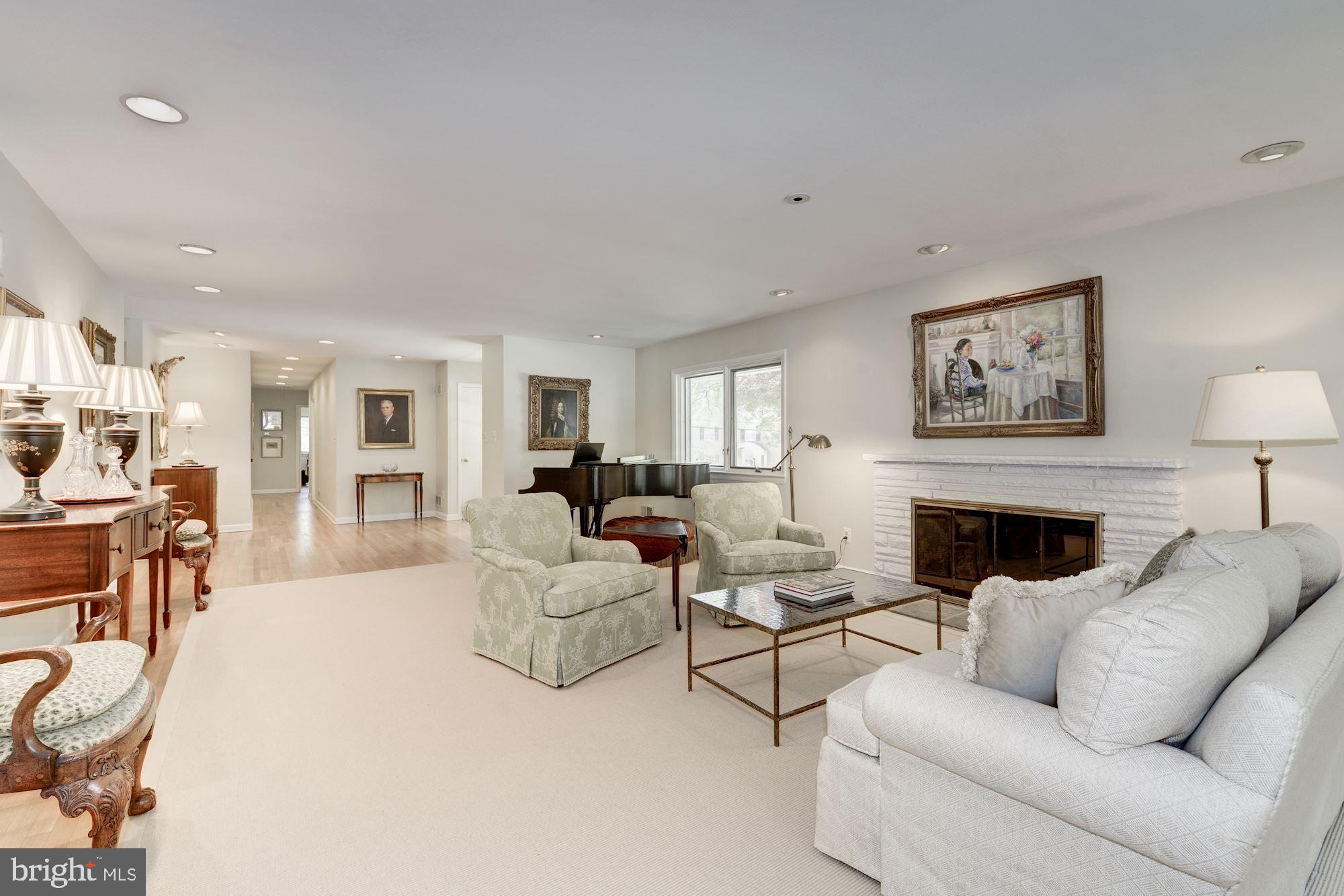 6129 Overlea Road Bethesda, MD 20816 - Photo 14 of 30 a living room with furniture and a fireplace
