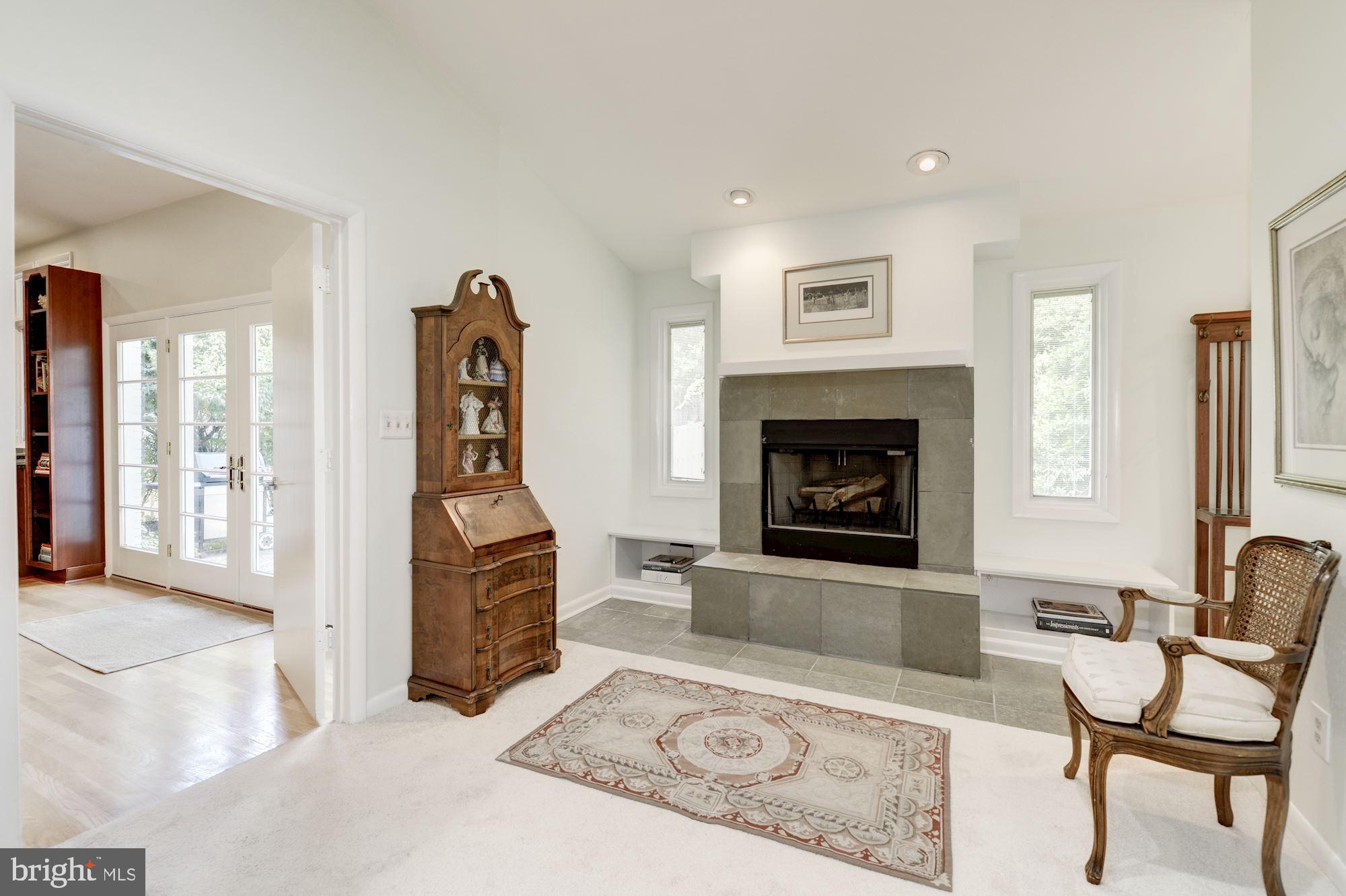 6129 Overlea Road Bethesda, MD 20816 - Photo 24 of 30 a living room with furniture and a fireplace