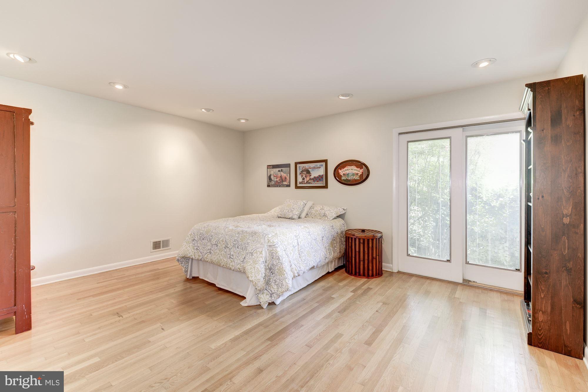 6129 Overlea Road Bethesda, MD 20816 - Photo 8 of 30 a bedroom with a bed and a large window