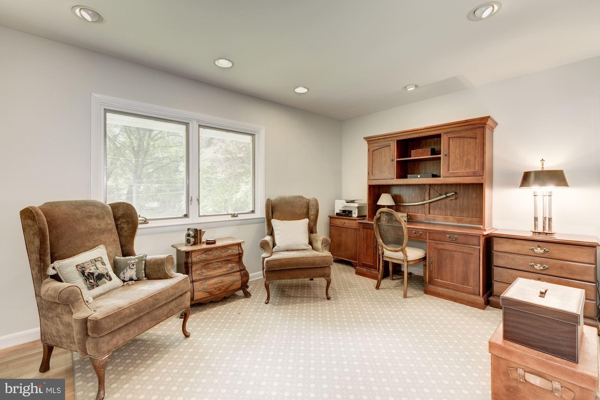 6129 Overlea Road Bethesda, MD 20816 - Photo 10 of 30 a living room with furniture and a flat screen tv