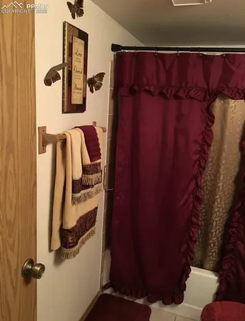 a bathroom with a bathtub and shower