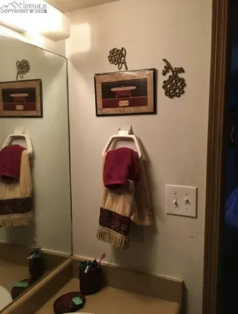 a bathroom with a toilet and a sink