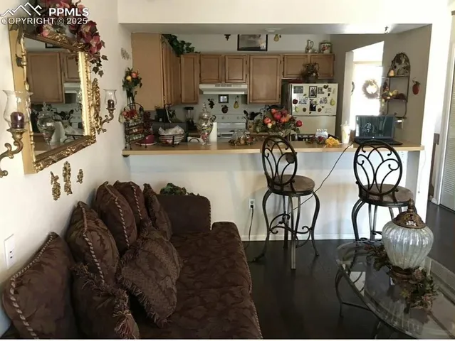 a living room with patio furniture and a view of living room
