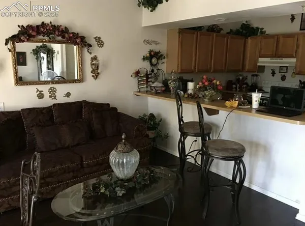 a kitchen with a table and chairs in it