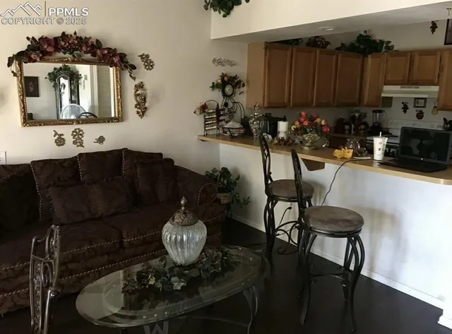 a kitchen with a table and chairs in it