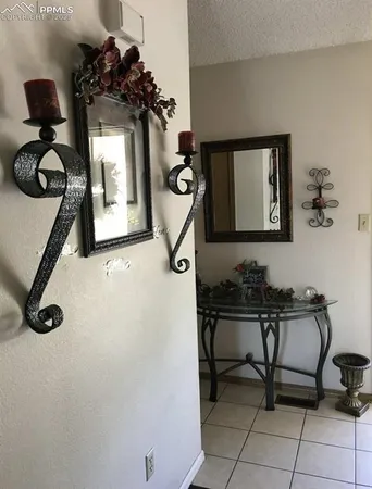 a bathroom with a sink mirror and window