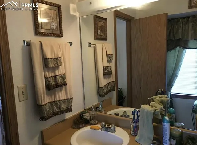 a bathroom with a sink and mirror
