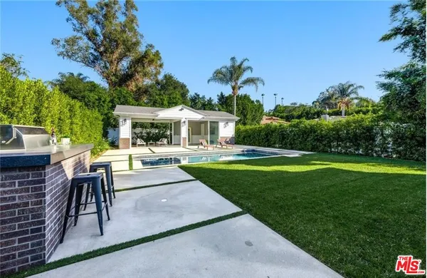 a view of a house with a swimming pool