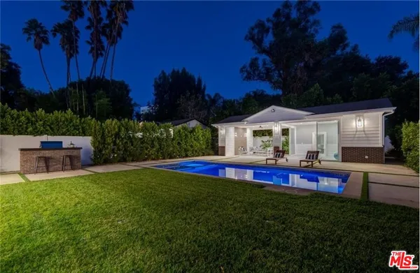 a view of house with outdoor space and garden