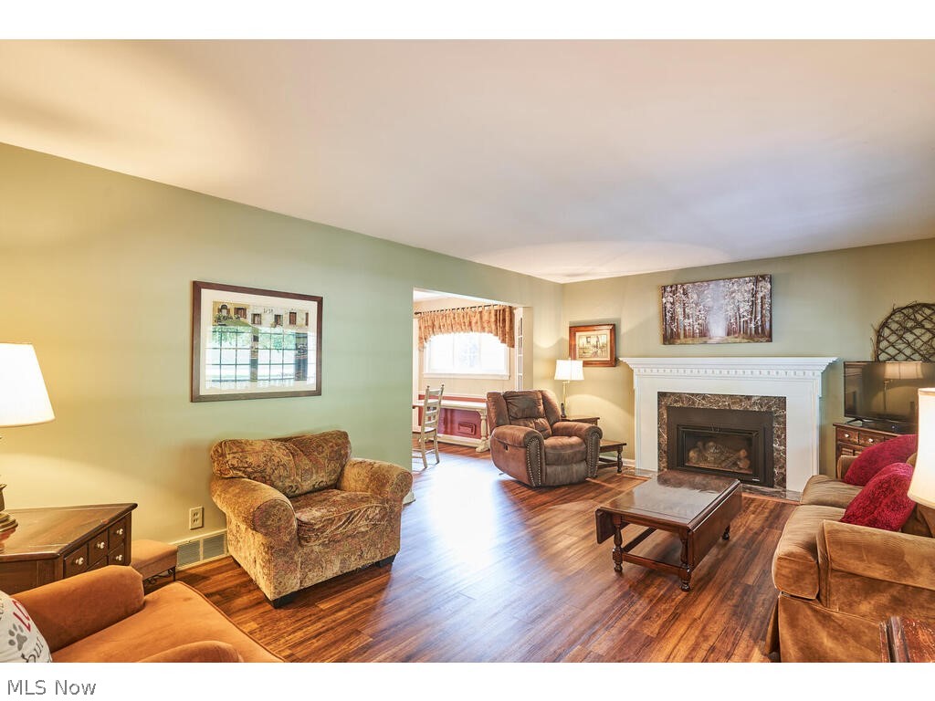 616 Hampshire Road Fairlawn, OH 44333 - Photo 3 of 32 The living room has a gas fireplace and updated LTV flooring