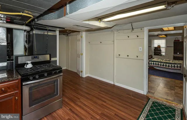 a kitchen with a stove and a refrigerator