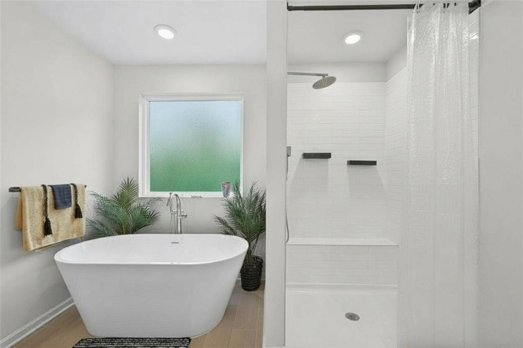 480 Overlook Road Covington, GA 30014 - Photo 7 of 20 a bathroom with a tub and shower