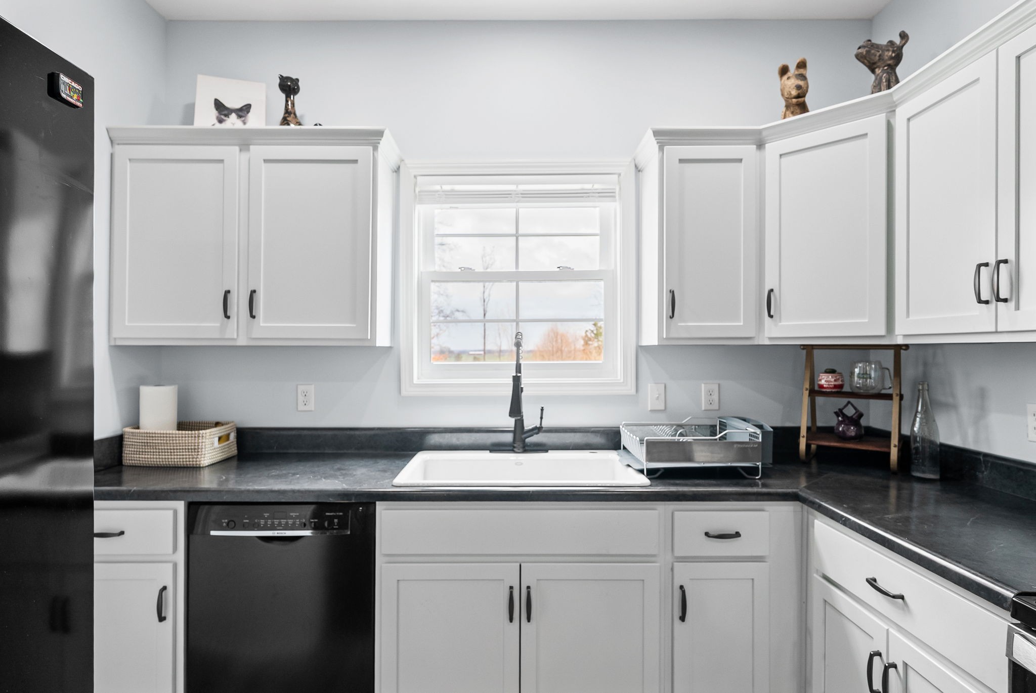 1698 Montgomery Church Road Cadiz, KY 42211 - Photo 12 of 39 a kitchen with white cabinets and sink