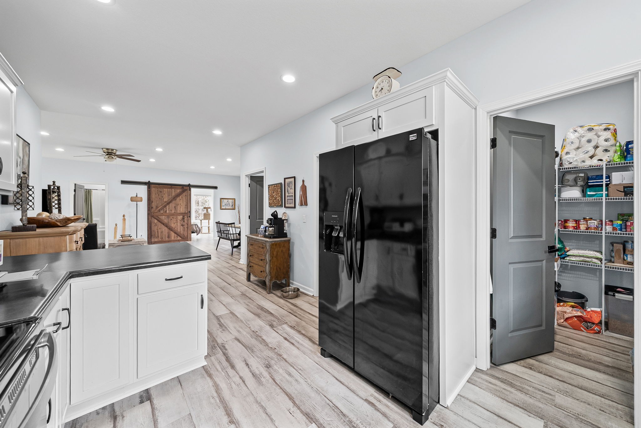 1698 Montgomery Church Road Cadiz, KY 42211 - Photo 13 of 39 a open kitchen with white cabinets and stainless steel appliances