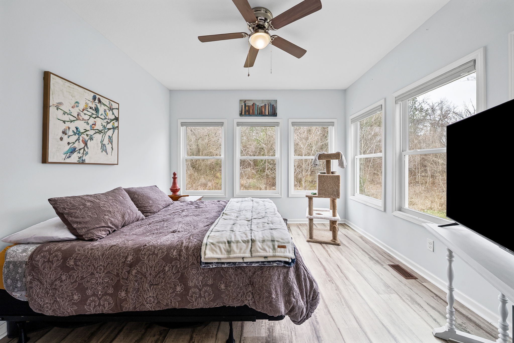 1698 Montgomery Church Road Cadiz, KY 42211 - Photo 16 of 39 a bedroom with a large bed a flat screen tv and a window
