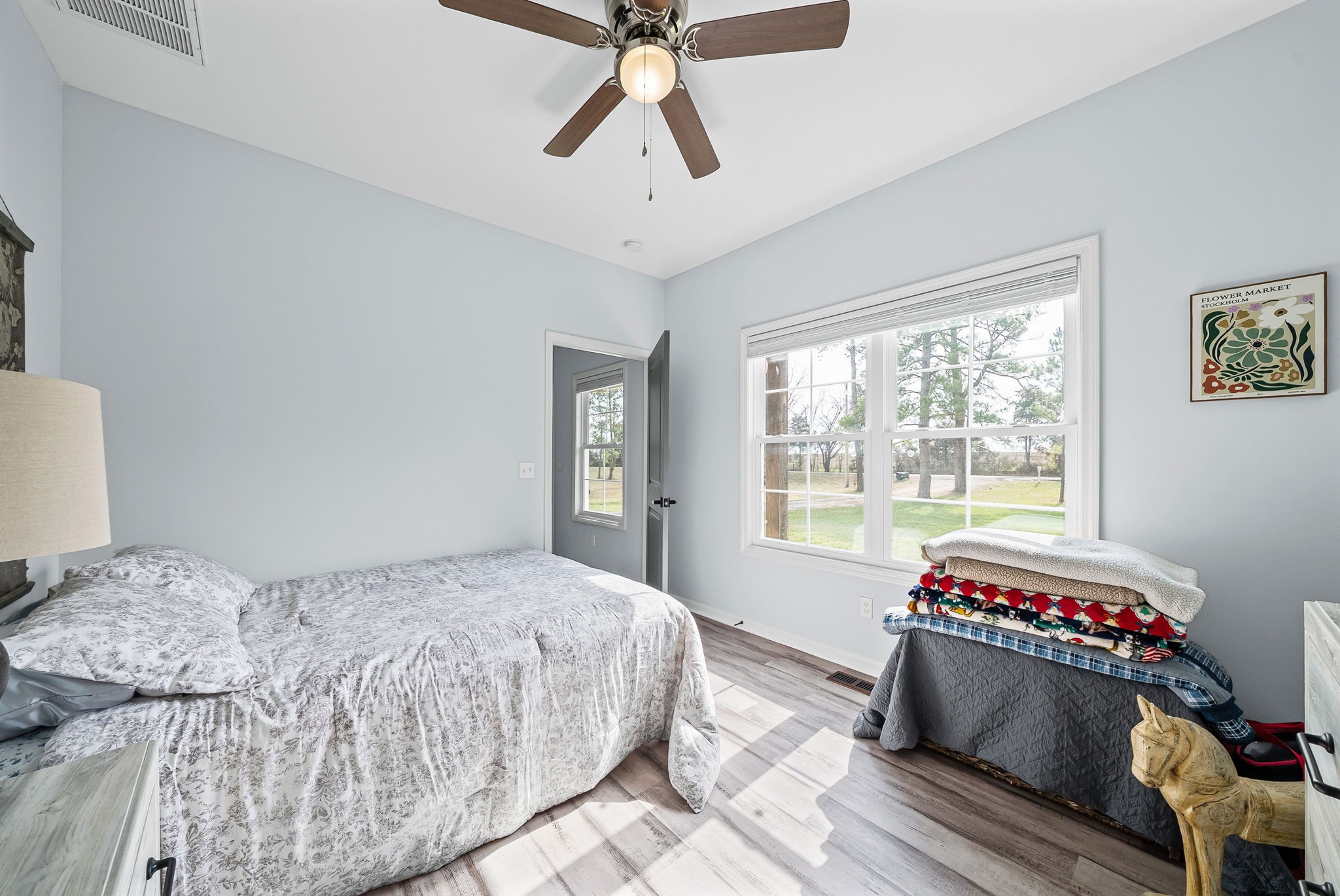 1698 Montgomery Church Road Cadiz, KY 42211 - Photo 20 of 39 a bedroom with a bed and a chandelier