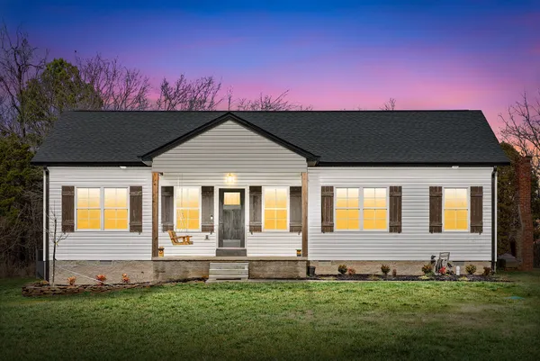 a front view of a house with a yard