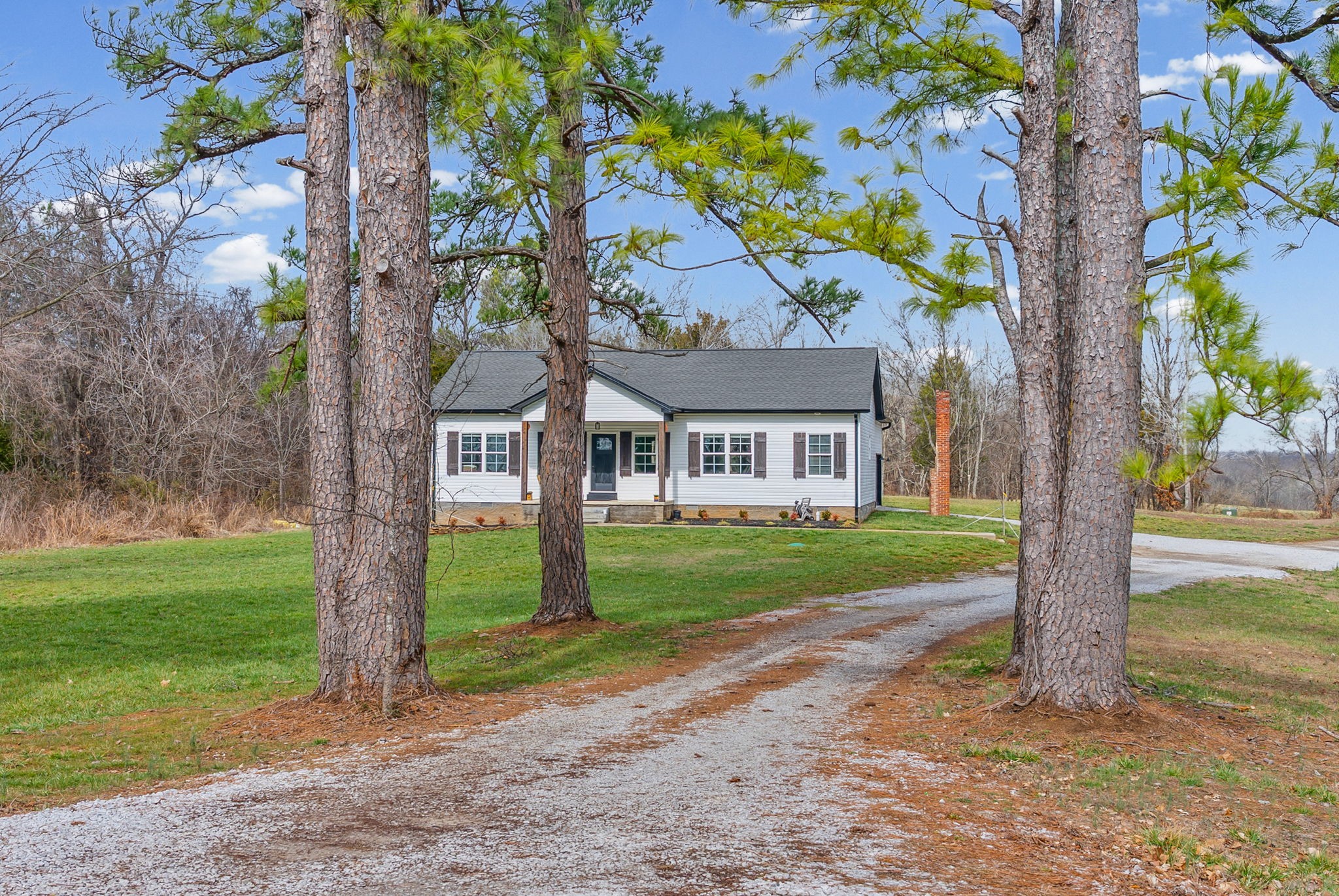 1698 Montgomery Church Road Cadiz, KY 42211 - Photo 4 of 39 a front view of a house with a garden