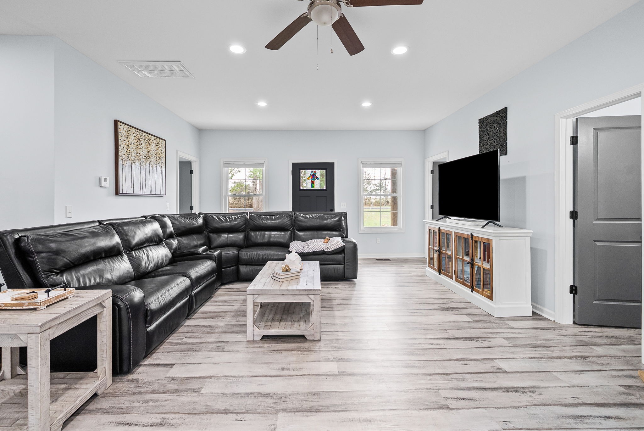 1698 Montgomery Church Road Cadiz, KY 42211 - Photo 8 of 39 a living room with furniture and a flat screen tv