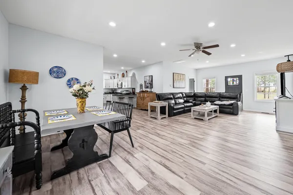 a kitchen with stainless steel appliances a stove top oven a counter space and cabinets