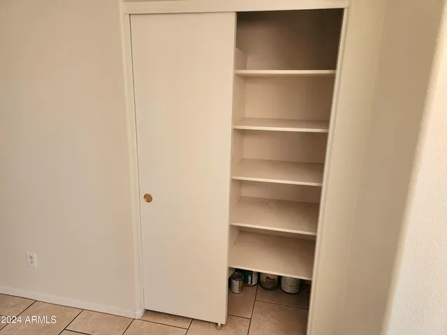 a view of an empty walk in closet