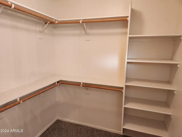 a view of an empty walk in closet