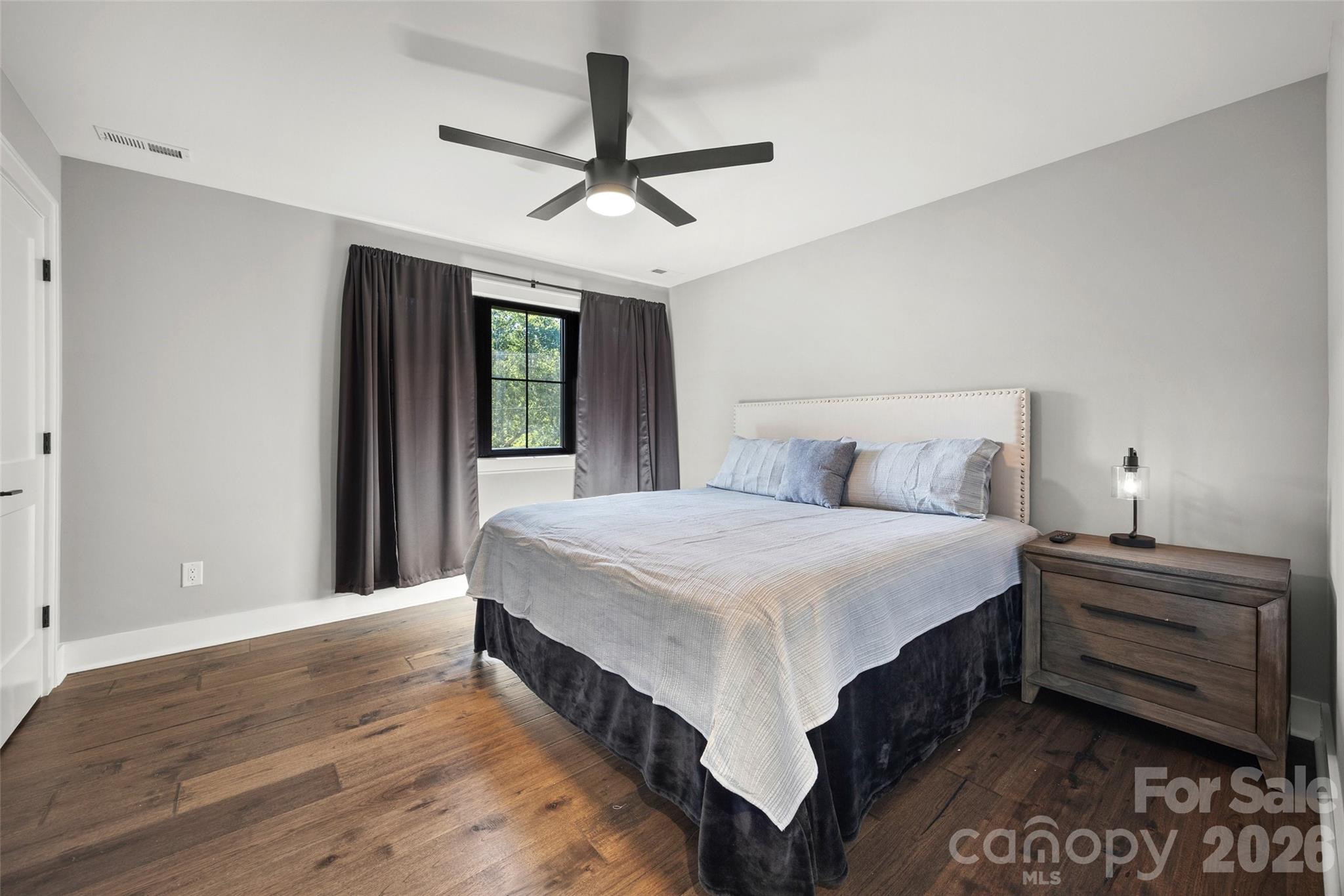 5438 Ralph Harper Lane Clover, SC 29710 - Photo 26 of 28 a bedroom with a bed next to a window