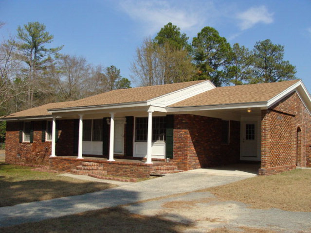 4550 Dixon Road Lizella, GA 31052 - Photo 1 of 1 a front view of a house with a garden
