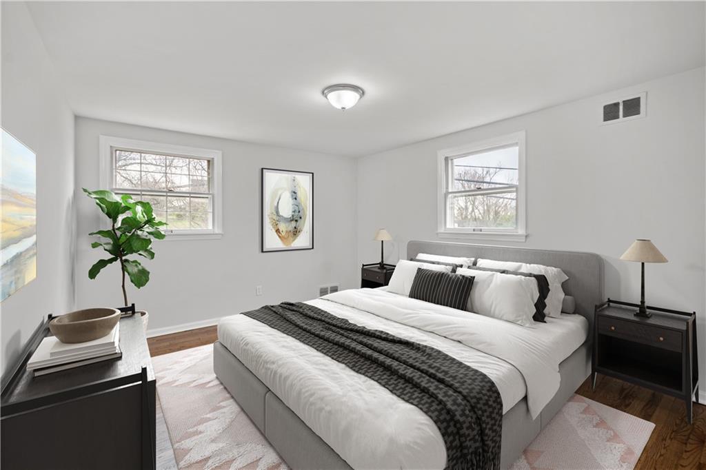 29 Carleton Drive Pittsburgh, PA 15243 - Photo 15 of 25 a bedroom with a bed and a potted plant