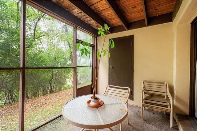 a dining room with a table and chairs