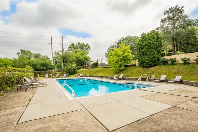 a view of a swimming pool with lounge chair
