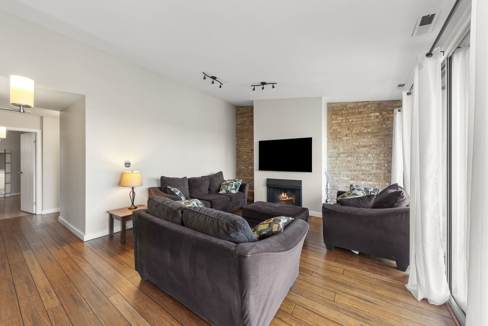 6010 Forest View Road, Unit 3A Lisle, IL 60532 - Photo 2 of 20 a living room with furniture and a flat screen tv
