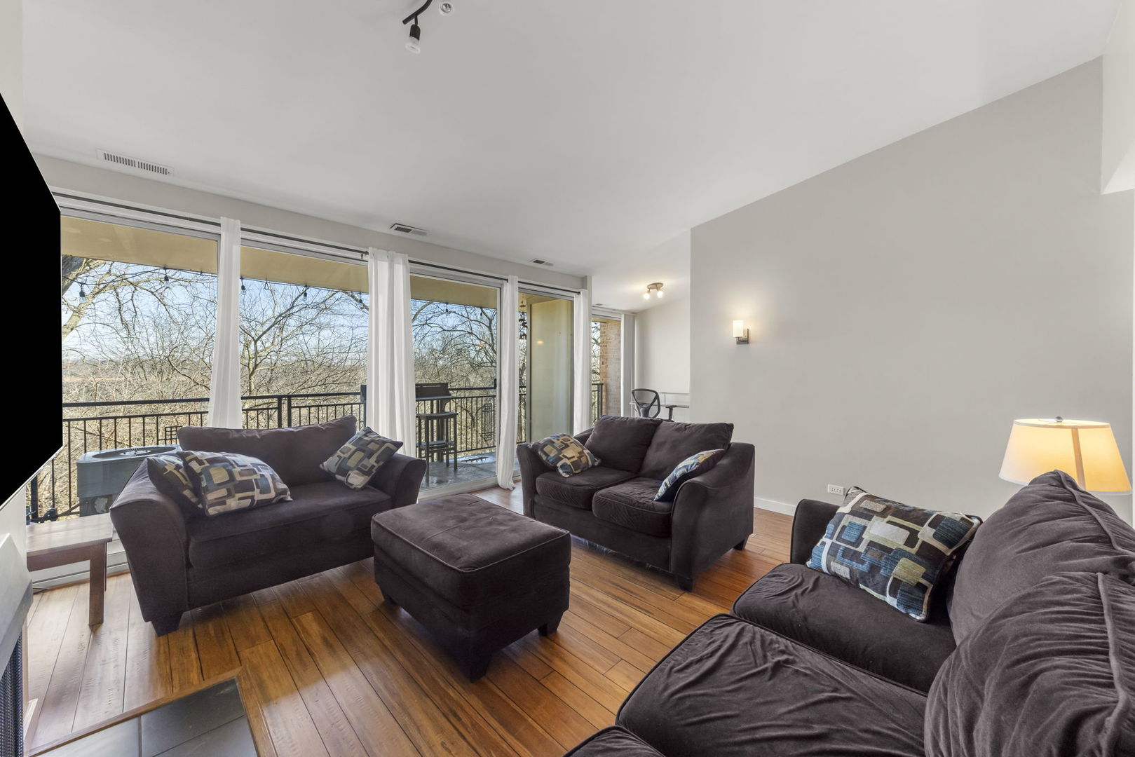 6010 Forest View Road, Unit 3A Lisle, IL 60532 - Photo 3 of 20 a living room with furniture and a large window