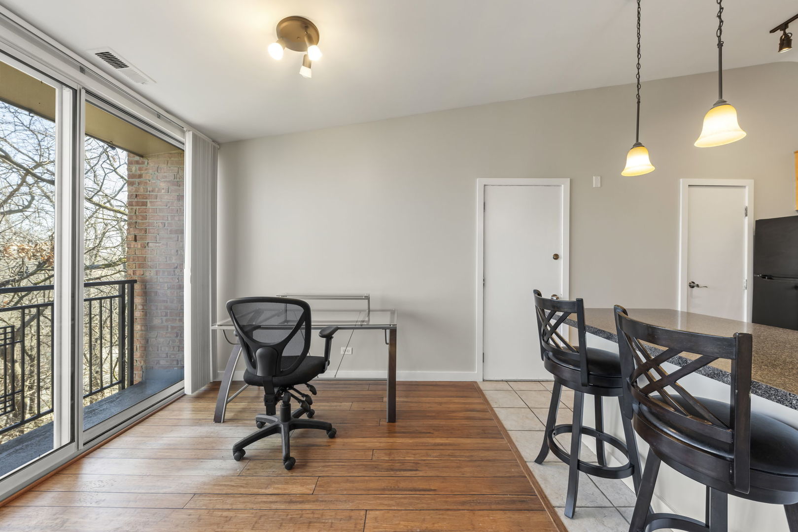 6010 Forest View Road, Unit 3A Lisle, IL 60532 - Photo 6 of 20 a view of a workspace with furniture and a window