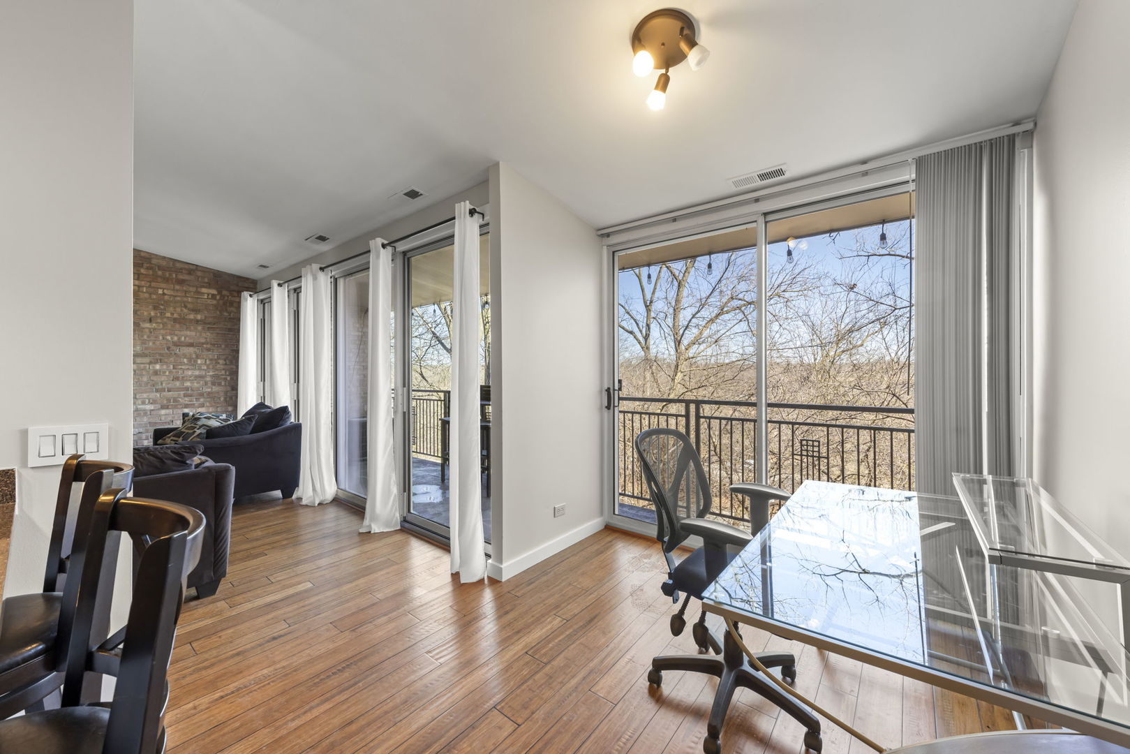6010 Forest View Road, Unit 3A Lisle, IL 60532 - Photo 7 of 20 a view of a livingroom with furniture and hardwood floor