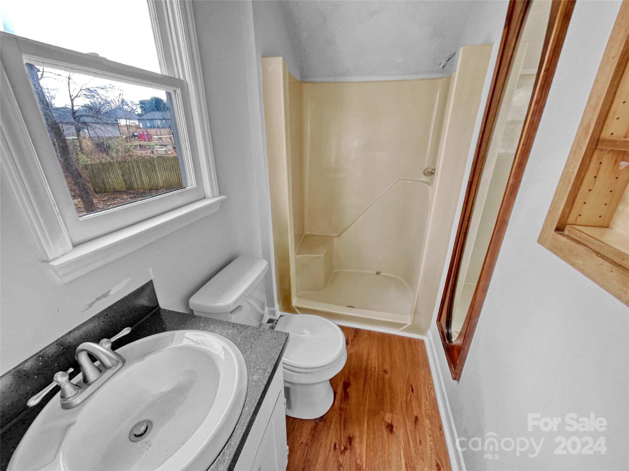 506 Ralph Handsel Boulevard Stanley, NC 28164 - Photo 11 of 18 a bathroom with a sink and a mirror